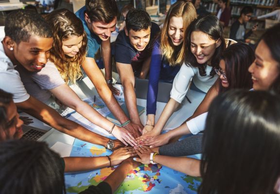 Students together as a team in class Students together as a team in class